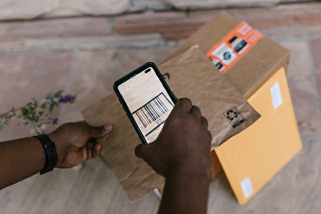 a man scanning a barcode.webp